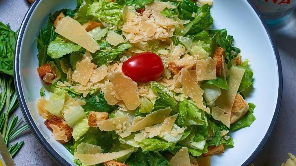 Caesar Salad · Romaine lettuce, homemade croutons, shaved parmesan tossed in homemade caesar dressing.