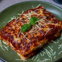 Lasagna · Homemade pasta layered with bolognese sauce, ricotta cheese, basil and topped with mozzarell...