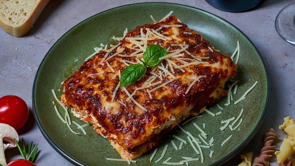 Lasagna · Homemade pasta layered with bolognese sauce, ricotta cheese, basil and topped with mozzarella.. Note: This item has a prep time of 12 minutes.  No substitutions on lasagna.