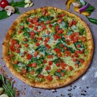 Pesto Spinachi Pizza · Pesto Cream*, fresh spinach, diced marinated tomatoes, mozzarella. *Contains tree nuts