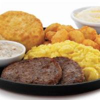 Breakfast Deluxe · Two scrambled eggs, home-style hearty grits, white sausage gravy, hash browns, and a  made-f...
