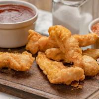 Chicken Tenders · A timeless favorite, our juicy chicken tenders are fried to golden-brown goodness. Served wi...