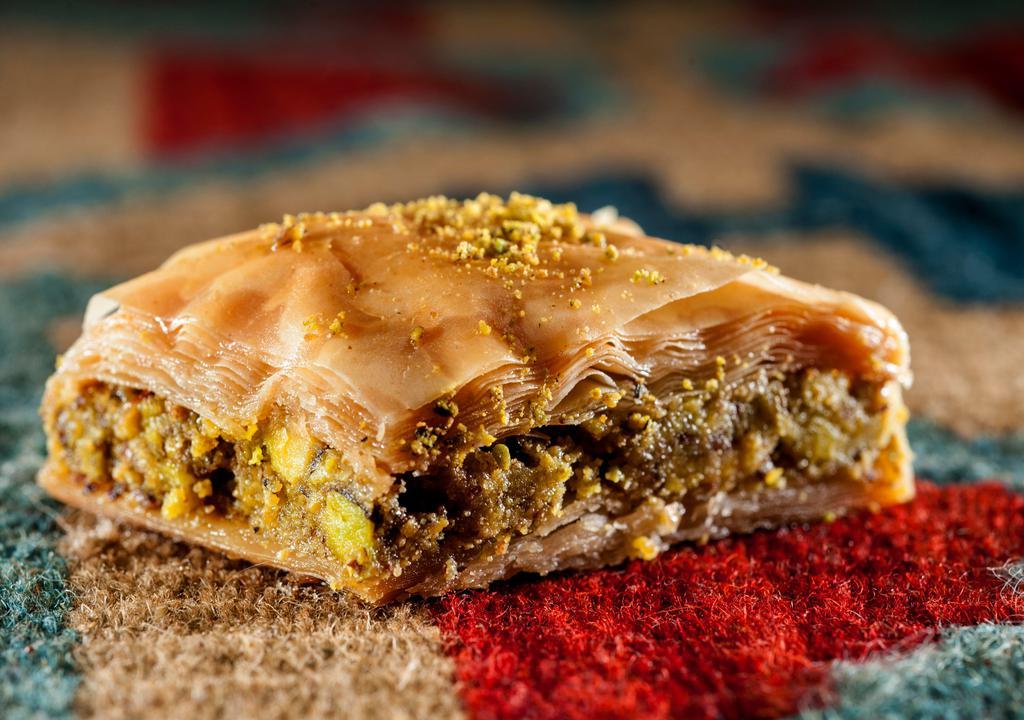 Walnut Baklava · Traditional diamond-shaped sweet pastry made with filo dough and walnuts.