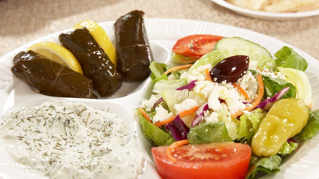 Greek Veggie · Fresh Greek salad, stuffed grape leaves, cucumber sauce and grilled Grecian pita.