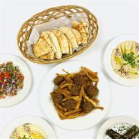 Sultan Mezza Combo · Hummus, baba ganoush, falafel, grape leaves, casa chips, and tabouli, served with pita.