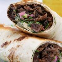 Beef Shawarma · Marinated lamb , onions, parsley, tomatoes, french fries & yogurt dressing wrapped in pita b...