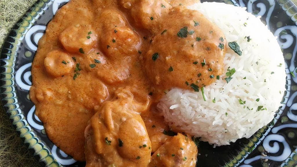 Lamb Mafe · Lamb stew with vegetables in creamy rich peanut butter sauce served over white rice.