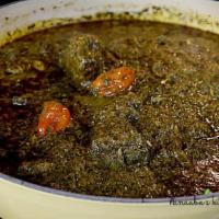 Cassave Leaf Stew · Mixed lamb and fish in golden palm oil stew flavored with chopped cassava leaf, served with ...