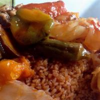 Thiebu Djen · (Fried rice w/tomato or white sauce) fish stew, cassava, carrots, eggplants, white cabbage &...