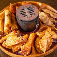 Pu-Pu Platter · Coconut Shrimp, Vegetable or Pork Lumpia, Crab Cake Balls, Chicken Skewers, and Wings.