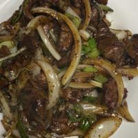Mongolian Beef · Spicy. Sliced beef stir fried with onion and cooked with chefs special secret black pepper s...