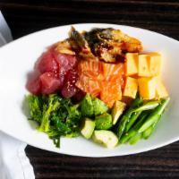 Poke Bowl · Eel, salmon, tuna, avocado, asparagus, seaweed salad and tamago over sushi rice and poke sauce