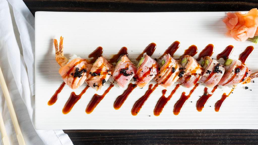 Black And Gold Roll · Shrimp tempura, avocado, crunch topped with seared tuna, salmon, tobiko served with chef's special sauce.