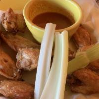Chicken Wings · Meaty wings served with our special hot sauce for a zesty start to your meal. Served with ra...