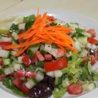Israeli Salad · Diced cucumber, tomato, green onion, lemon juice, extra virgin olive oil, and parsley.