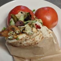 Green Omelette Pita · An omelet cooked with fresh green herbs served in a pita and dressed with Israeli salad.