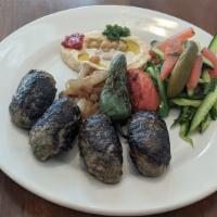 Beef Kebabs Platter · Grilled beef kebabs served with grilled tomato and onion, tahini, Israeli salad, fries, and ...