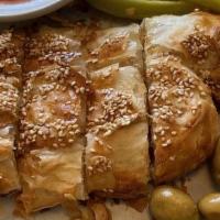 2 Burrekas · Savory puff pastries filled with cheese or potato, baked with sesame seeds on top. Please ca...