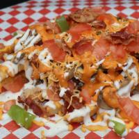 Mickey'S Cheese Fries · Our signature fries topped with Philly steak or grilled chicken, crispy bacon, grilled onion...