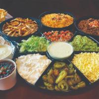 Taco Party Kit · 1 Large Bag of Chips 20 Tortillas 5 Pounds of Protein (Grill Chicken or Ground Beef) 24 oz. ...