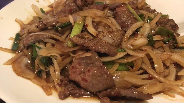 Mongolian Beef  · sauteed with scallions and onions .
