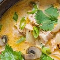 Tom Kha · Light coconut soup in aromatic galangal broth with mushrooms, cilantro, cherry tomatoes and ...