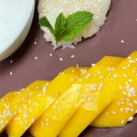 Mango Sticky Rice · Sweet rice pudding with mango.