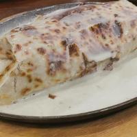 Burrito Asado · Grilled burrito stuffed with carnitas, chicken, steak, black beans, sheered cheese rice, pic...