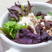 Green Salad - Sin Variación · Mixed greens, feta cheese, dry cranberries or currants, sunflower seeds and a vinaigrette.