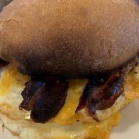 Breakfast Sandwich · Egg, cheddar and a choice of bacon & spread.