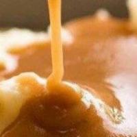 Mashed Potatoes With Gravy · Side of Mashed Potatoes with Gravy.