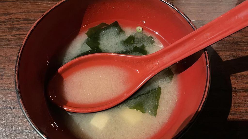 Miso Soup · Miso soup with tofu, green onion and diced seaweed.