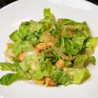 Caesar · Romaine lettuce, croutons, tossed and finished with grated parmesan.