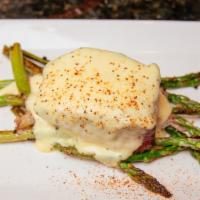 Steak Oscar · Grilled steak filet, topped with jumbo lump crab meat and bearnaise sauce, served with aspar...