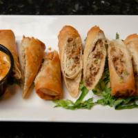 Lumpia · Four beef lumpia served with sweet chili sauce.