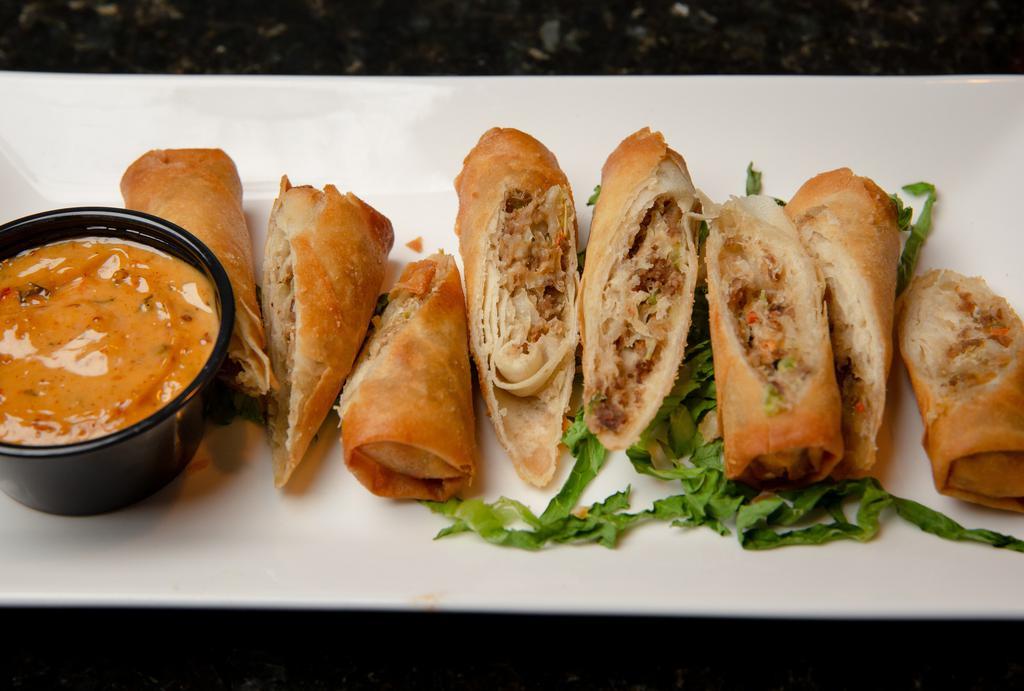 Lumpia · Four beef lumpia served with sweet chili sauce.