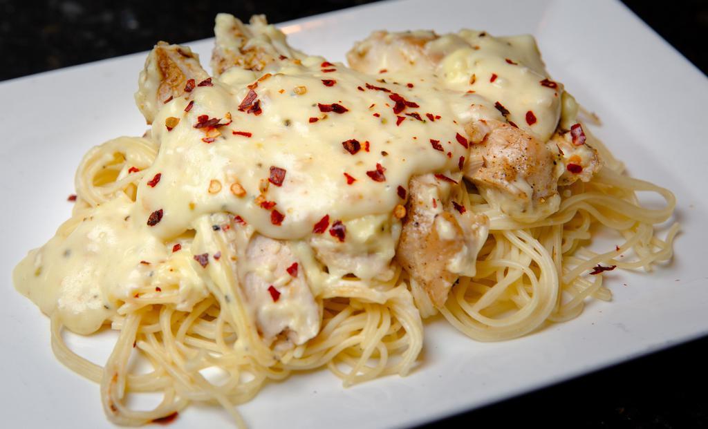 Lemon Pepper Chicken · Seasoned chicken breast with angel hair pasta and a garlic parmesan cream sauce.