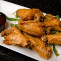 Wings · Six wings fried crispy and served with your choice of sauce.