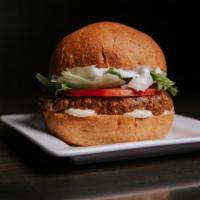 North Lamb Burger · Grass-fed new Zealand lamb, tzatziki sauce, diced onions, lettuce, tomato and garlic aioli, ...