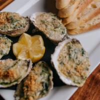 Rockefeller Oysters · Spinach, garlic, cream, pernod, parmesan cheese and breadcrumbs.