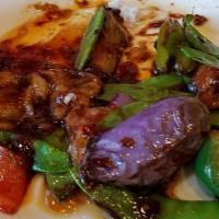 Ginger Garlic Eggplant · Served with steamed rice.
Green and red bell peppers, snow peas, eggplant, oyster sauce, spi...
