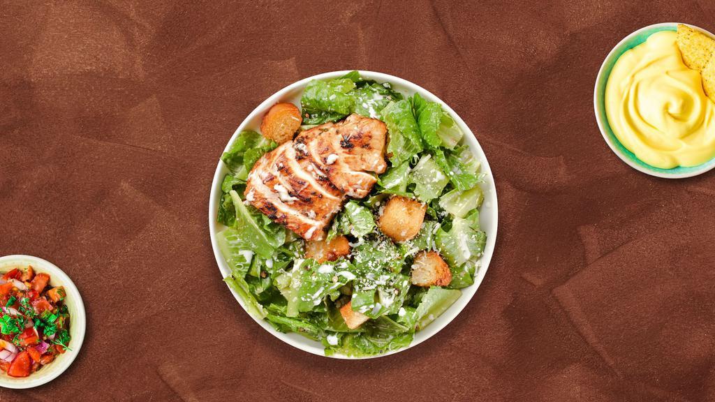 Classic Chicken Caesar Salad · Romaine lettuce, grilled chicken, house croutons, and parmesan cheese tossed with caesar dressing.