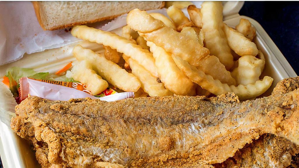Whole Catfish Dinner · Two whole catfish (bone-in), crinkle cut fries, green salad and bread.