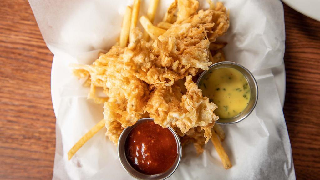 Crispy Tempura Chicken Tenders · On a bed of French fries with house-made hickory and Dijon sauce