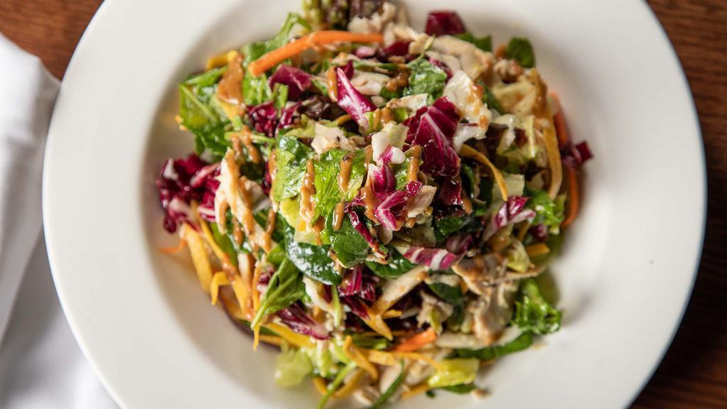 Grilled Chicken Salad · House greens, honey-chili vinaigrette with a touch of thai peanut sauce.