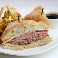 French Dip · Thinly sliced prime rib, mayo, and Monterey jack stacked on ciabatta bread. Comes with a sid...