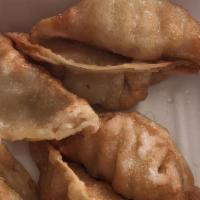 Gyoza (6 Pieces) · Deep fried pork and vegetable dumplings