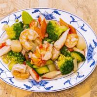 Seafood Combination · Lobster meat, shrimp, crab meat, and scallops with vegetable in tasty white sauce. Served wi...
