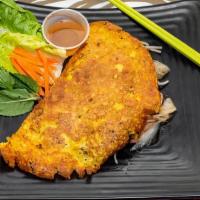 Vietnamese Crepe · Thin crispy rice and coconut flour crepe pan fried, then stuffed with onions, pork, shrimp a...