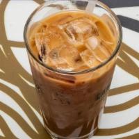 Vietnamese Iced Coffee · Chicory coffee in french drip-brewed over sweetened condensed milk then striped and poured o...